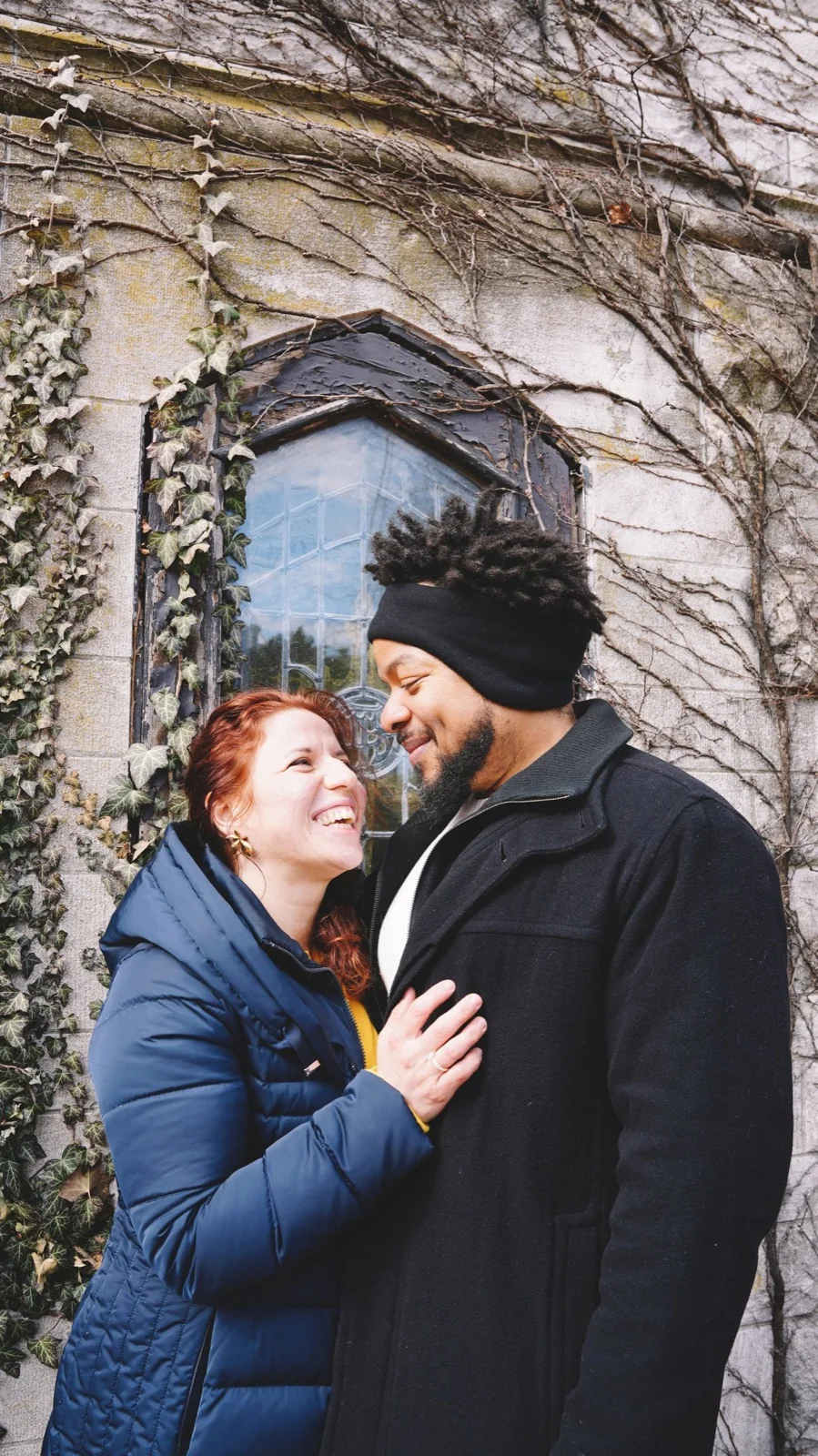 A couple sharing a laugh together outdoors